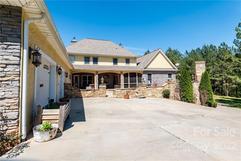 4597 Hickory Nut Ridge Road Granite Falls, NC 28630 - Photo 9 of 48 a front view of a house with sitting area