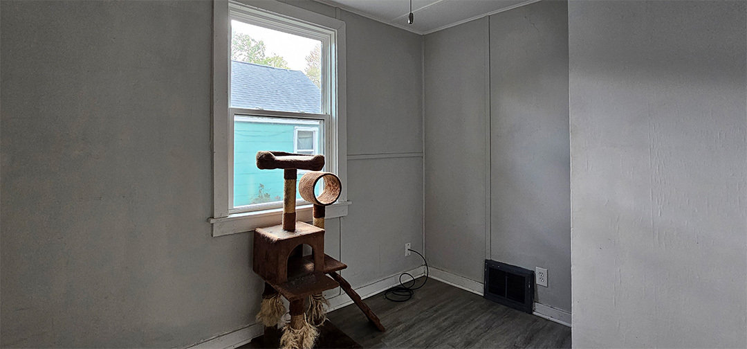 1009 8th Avenue Rock Falls, IL 61071 - Photo 11 of 16 a room with wooden floor and windows