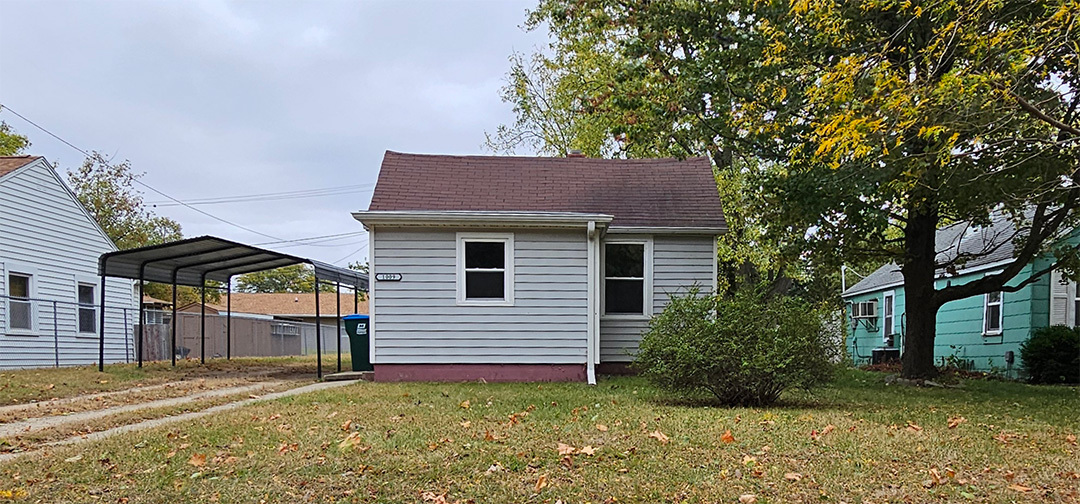 1009 8th Avenue Rock Falls, IL 61071 - Photo 2 of 16 a view of a house with a yard and large tree