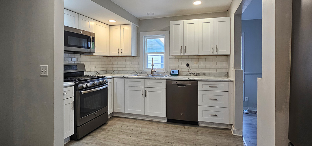1009 8th Avenue Rock Falls, IL 61071 - Photo 4 of 16 a kitchen with a sink stove and microwave