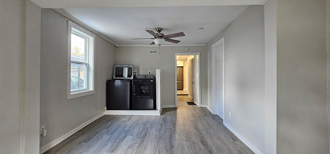 1009 8th Avenue Rock Falls, IL 61071 - Photo 7 of 16 wooden floor in an empty room with a window