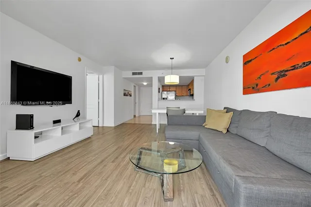 a bedroom with a bed and cabinets