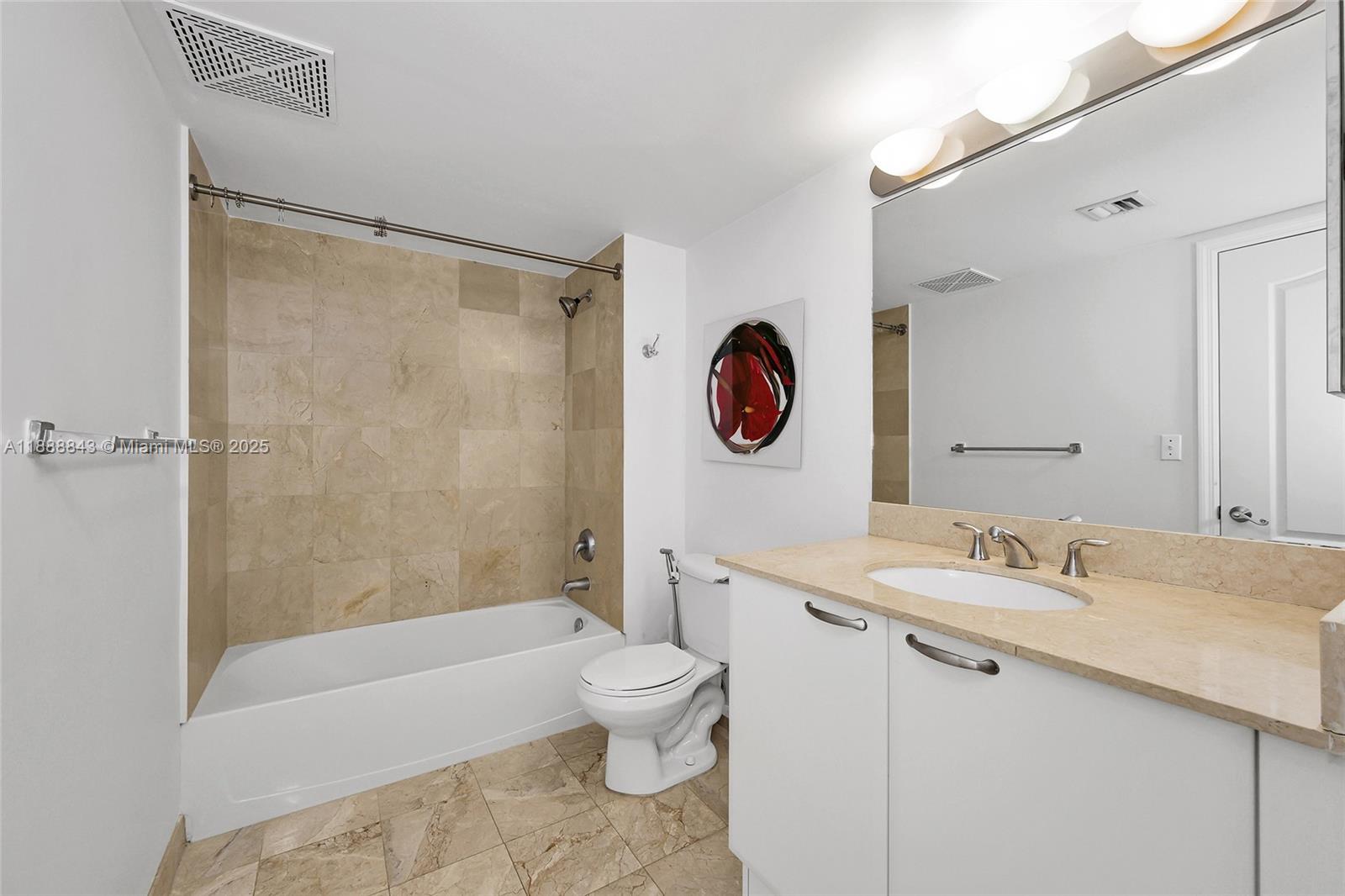 2101 Brickell Avenue, Unit 905 Miami, FL 33129 - Photo 14 of 23 a bathroom with a sink a toilet and a bathtub