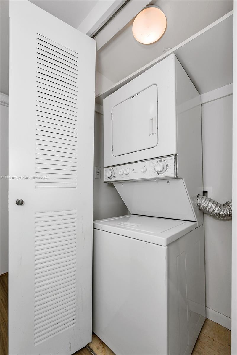 2101 Brickell Avenue, Unit 905 Miami, FL 33129 - Photo 17 of 23 a utility room with dryer and washer