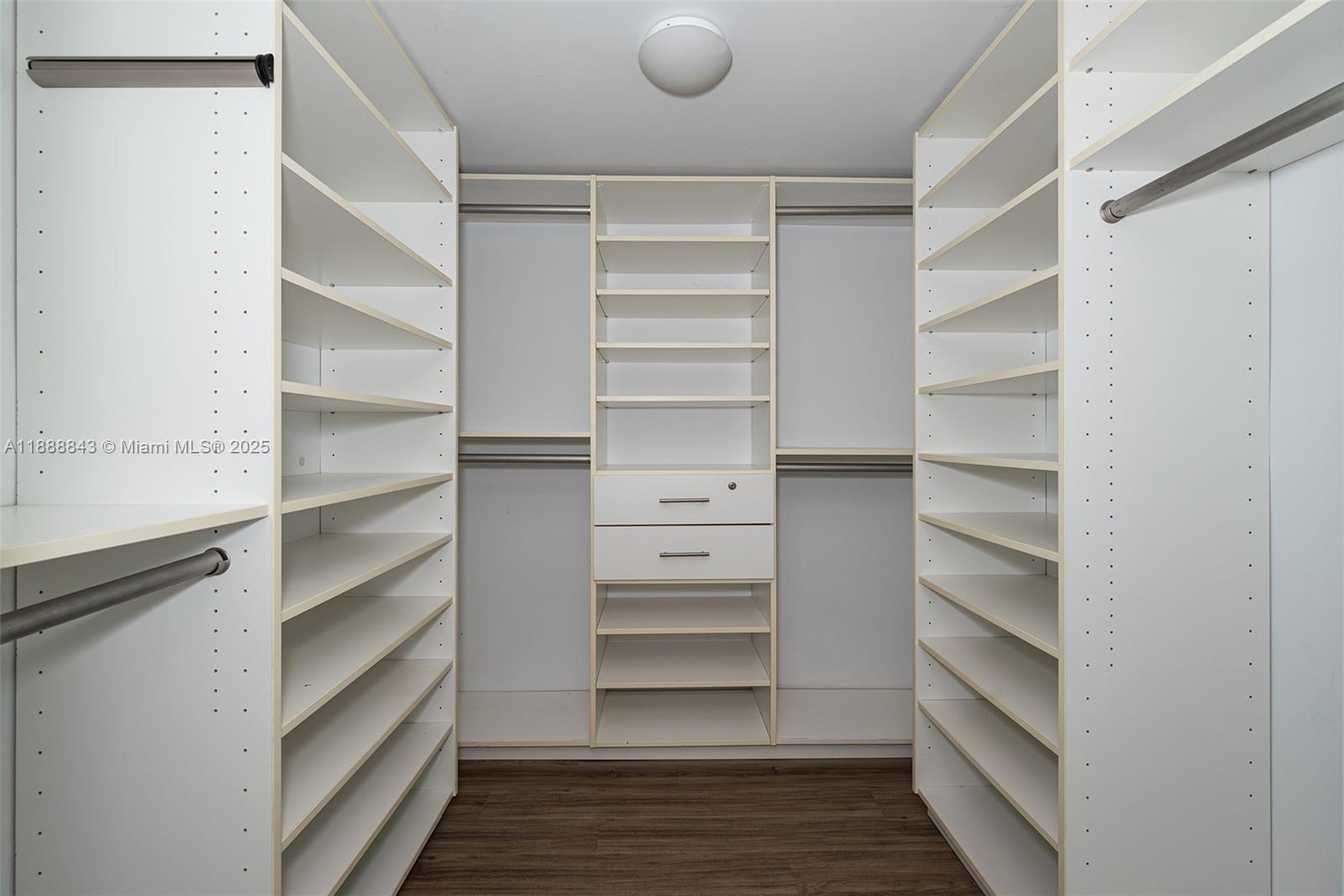 2101 Brickell Avenue, Unit 905 Miami, FL 33129 - Photo 19 of 23 a view of walk in closet with empty racks