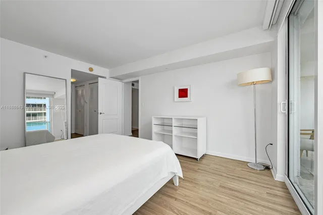 a bedroom with a bed and a table