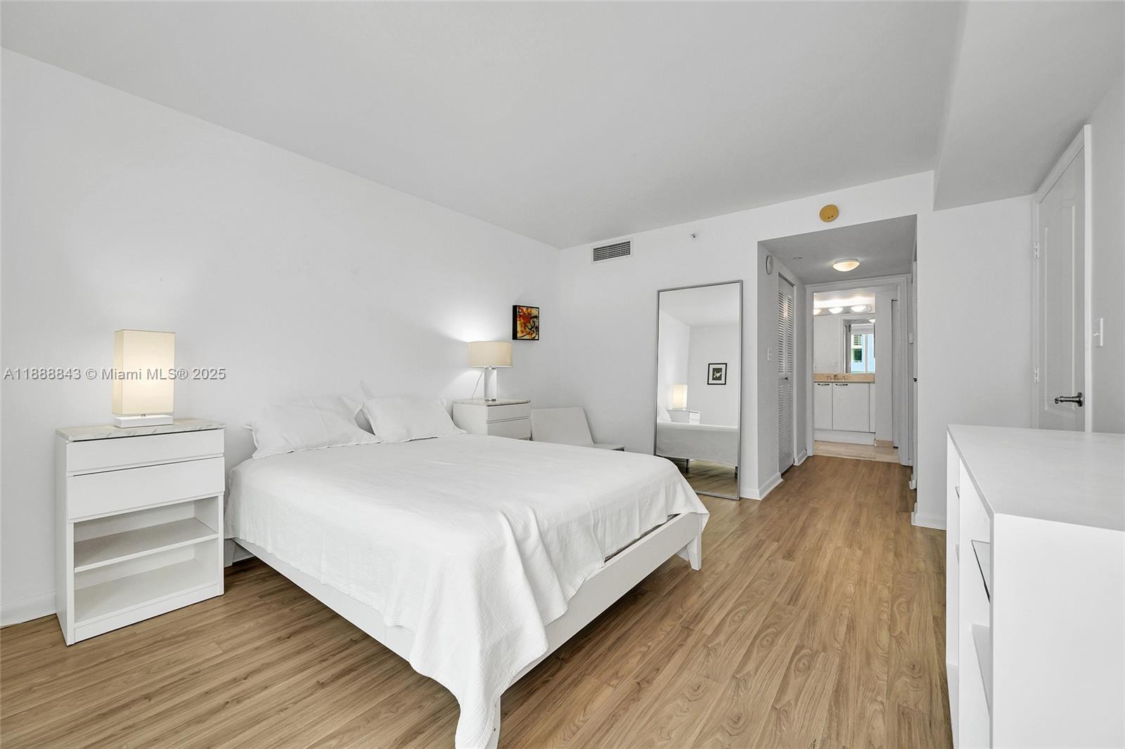 2101 Brickell Avenue, Unit 905 Miami, FL 33129 - Photo 22 of 23 a bedroom with a bed and a table