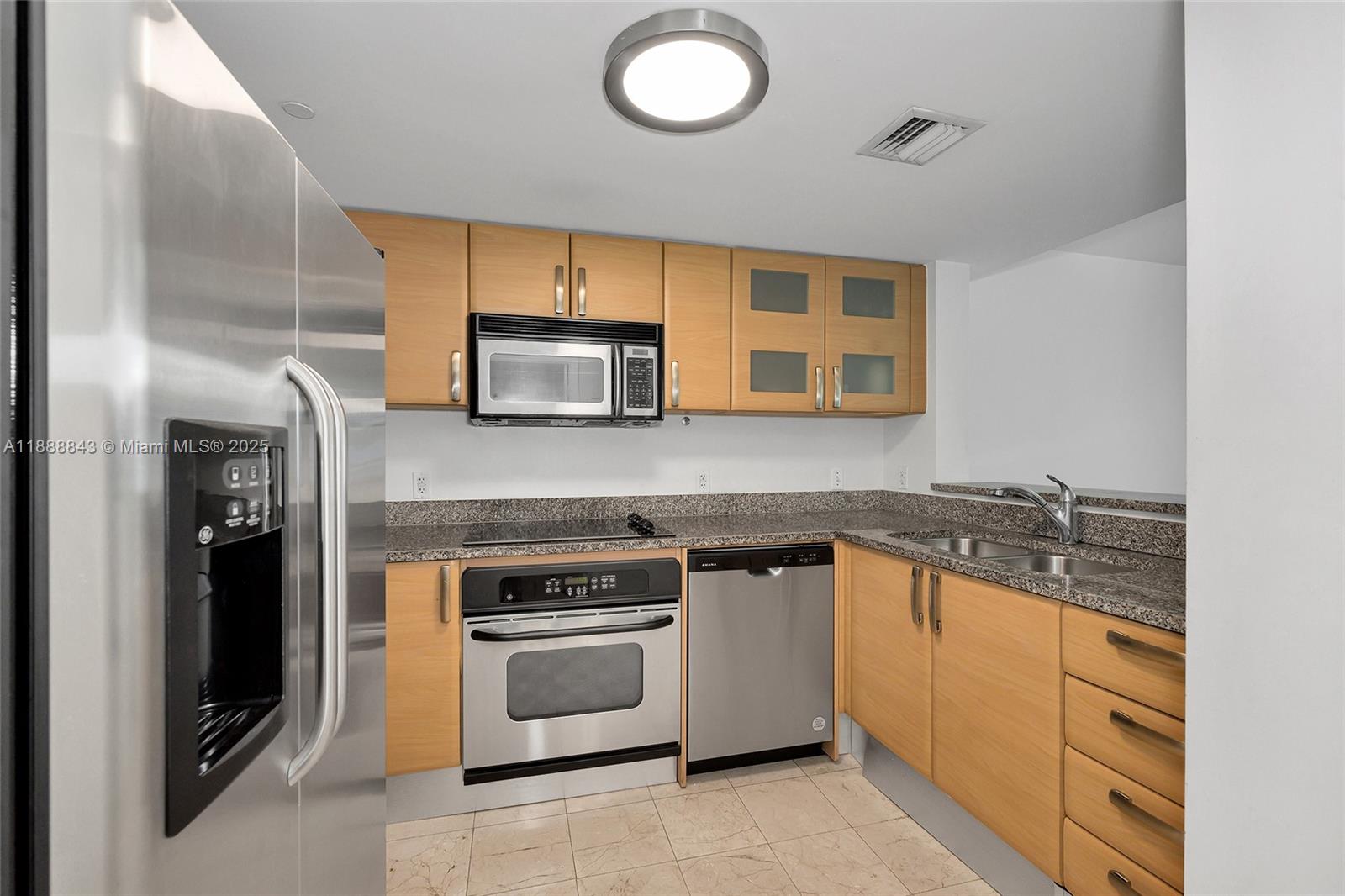 2101 Brickell Avenue, Unit 905 Miami, FL 33129 - Photo 3 of 23 a kitchen with a sink stove and microwave