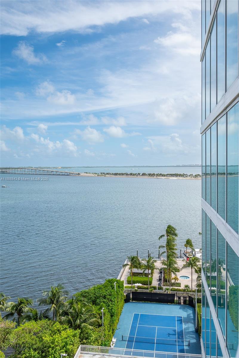 2101 Brickell Avenue, Unit 905 Miami, FL 33129 - Photo 9 of 23 a view of a balcony with wooden floor and ocean view