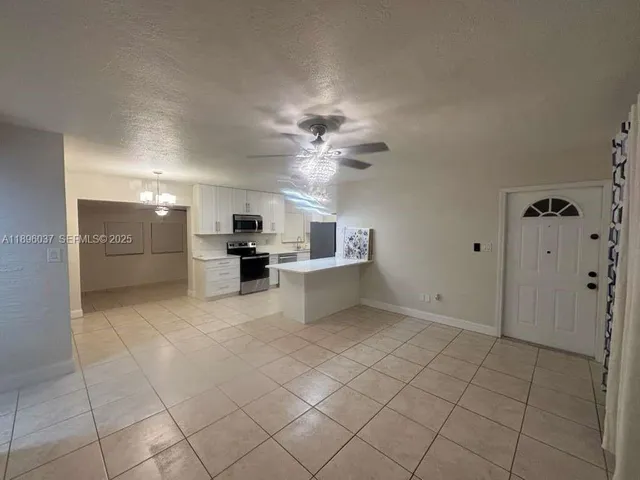 a view of a kitchen with furniture and a kitchen