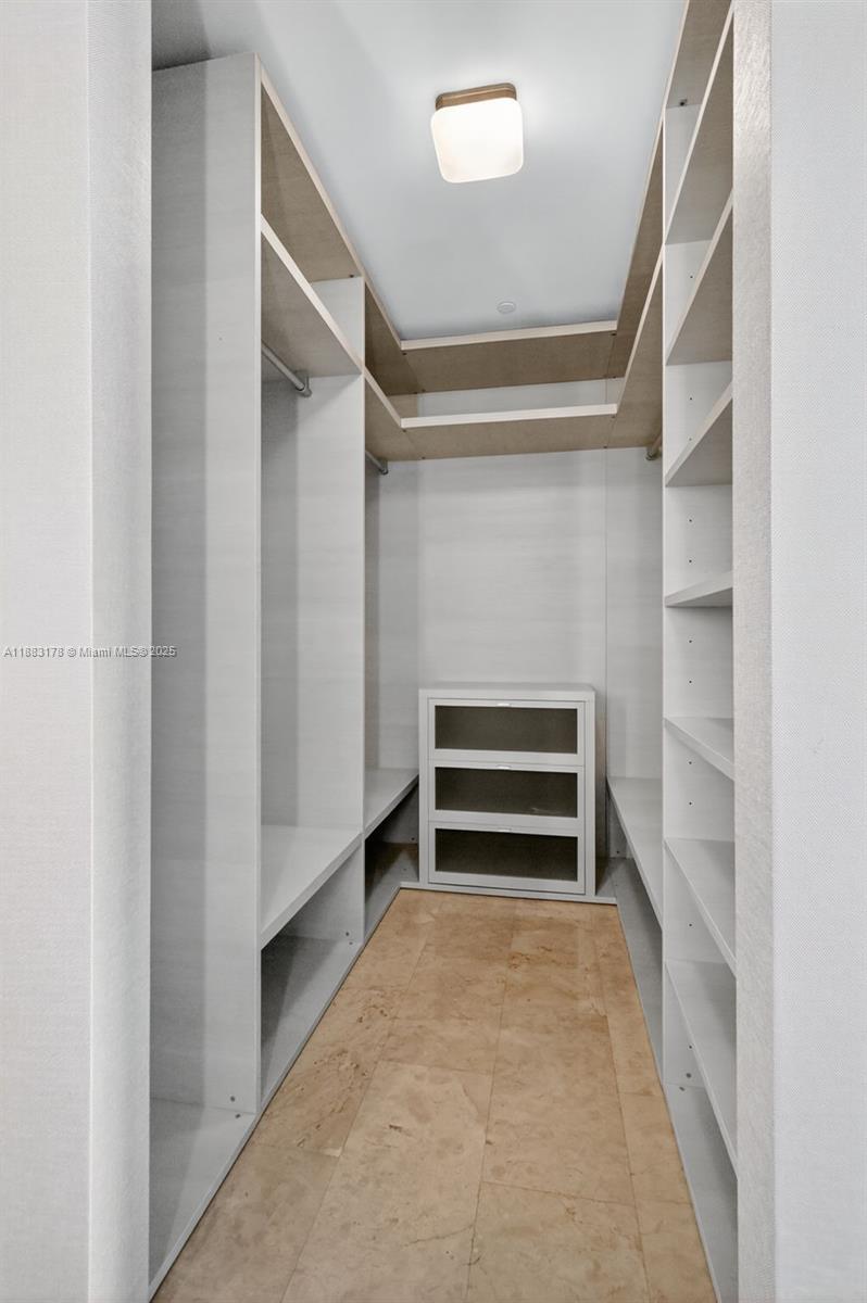 88 Southwest 7th Street, Unit 2402 Miami, FL 33130 - Photo 18 of 38 a view of an empty walk in closet