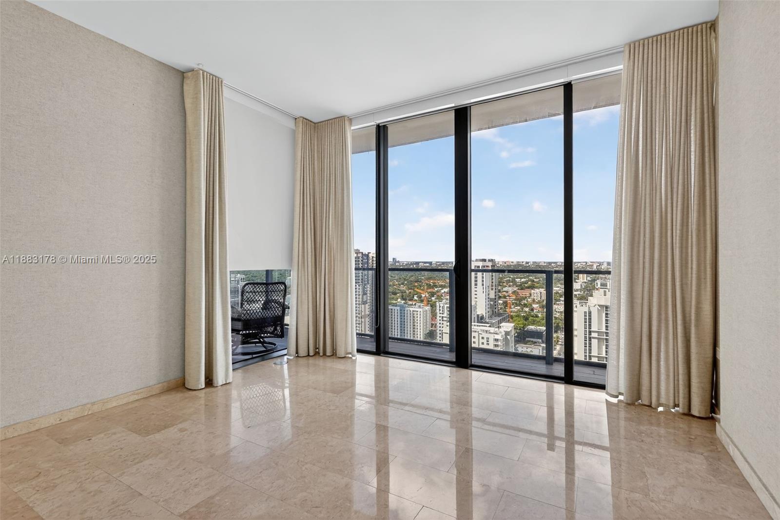 88 Southwest 7th Street, Unit 2402 Miami, FL 33130 - Photo 21 of 38 a view of an empty room with window and cabinet