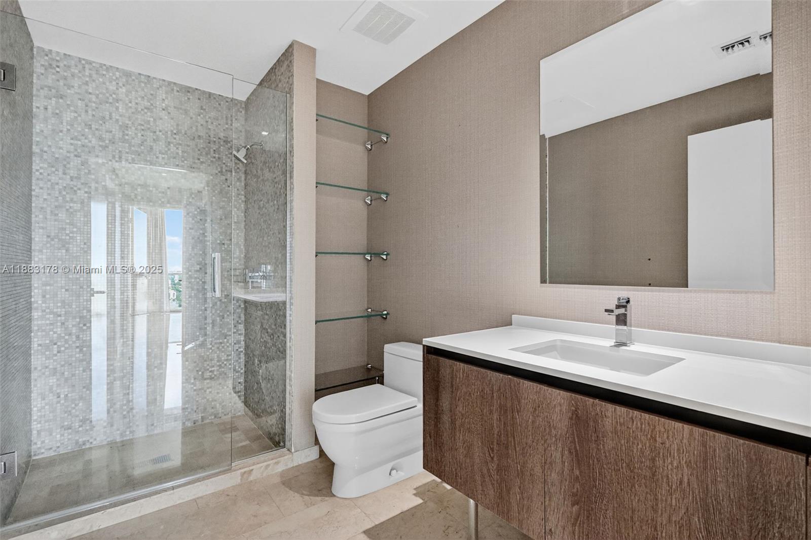 88 Southwest 7th Street, Unit 2402 Miami, FL 33130 - Photo 24 of 38 a bathroom with a sink a toilet and shower