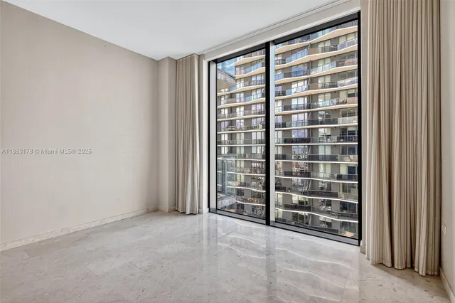 a view of a hallway with washer and dryer