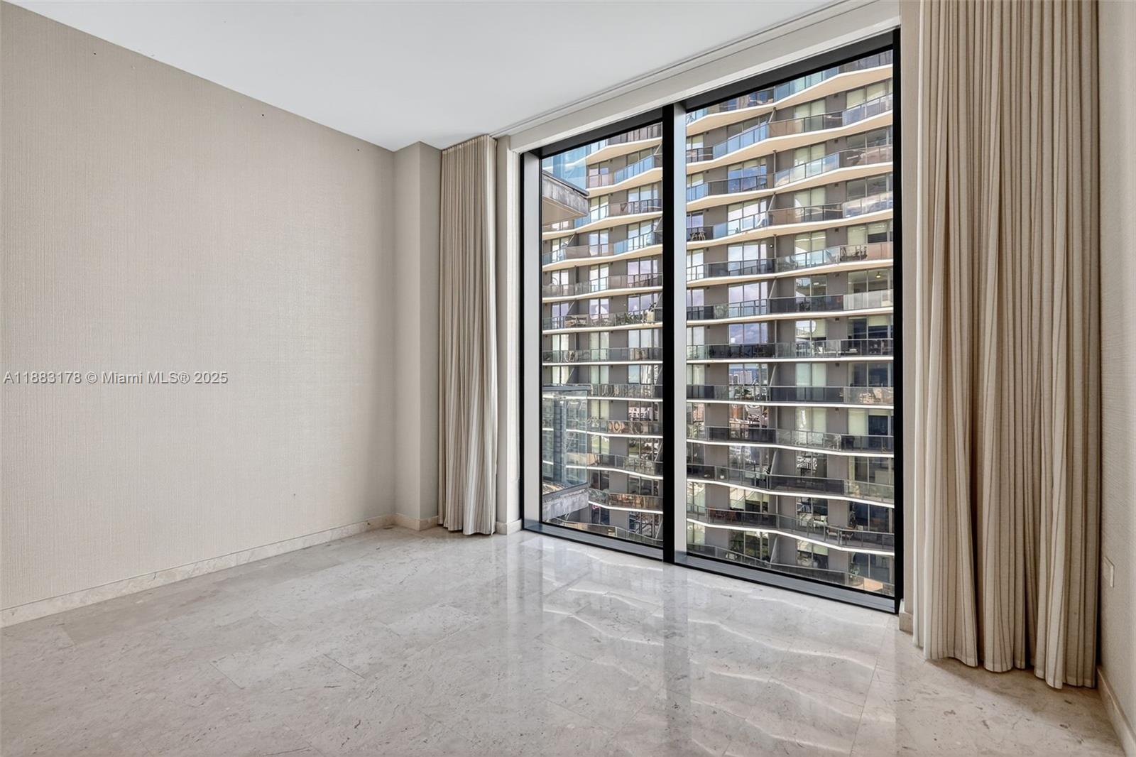 88 Southwest 7th Street, Unit 2402 Miami, FL 33130 - Photo 25 of 38 a view of an empty room with a window