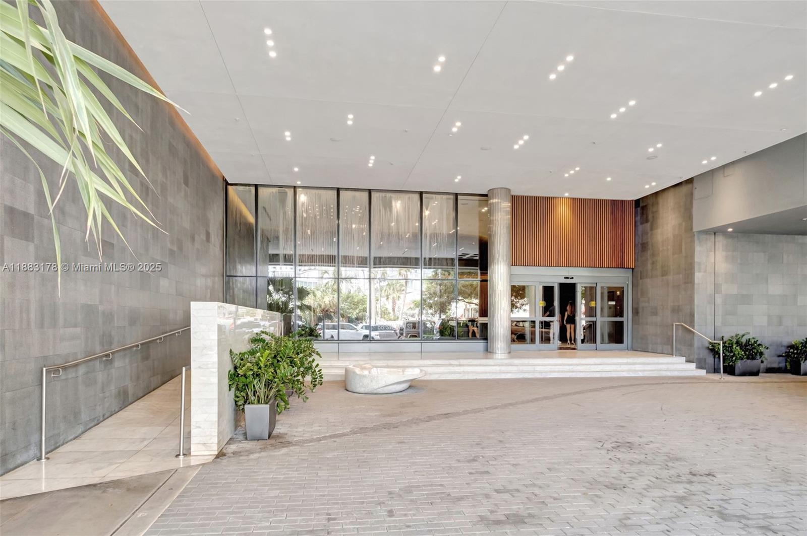 88 Southwest 7th Street, Unit 2402 Miami, FL 33130 - Photo 33 of 38 a living room with fireplace and a large window