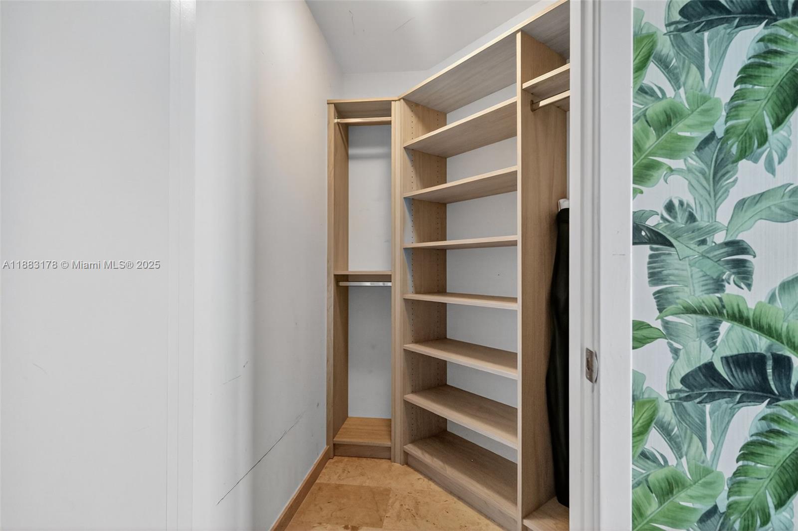 88 Southwest 7th Street, Unit 2402 Miami, FL 33130 - Photo 9 of 38 a view of walk in closet with empty racks