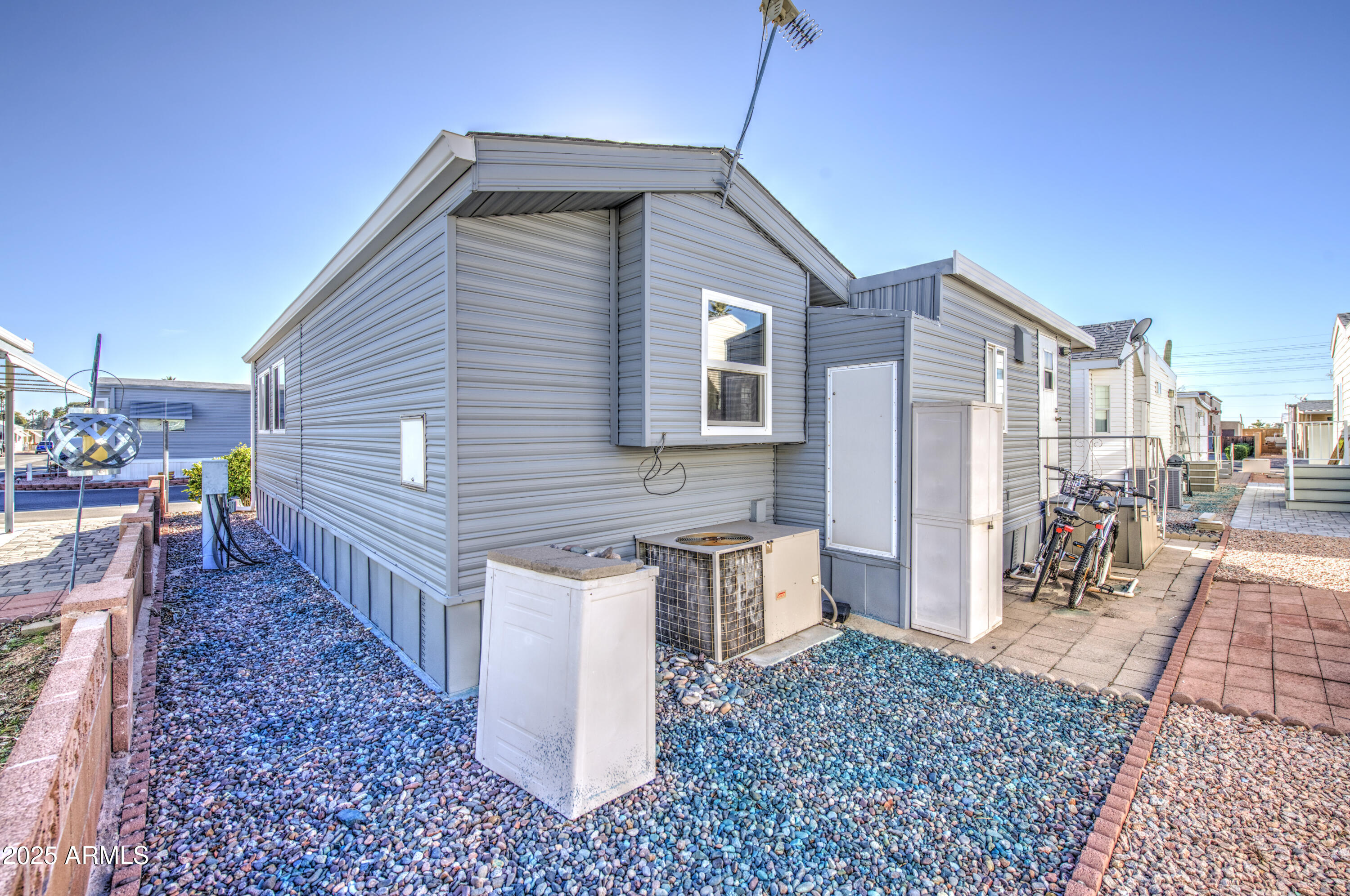 7750 East Broadway Road, Unit 780 Mesa, AZ 85208 - Photo 31 of 44 a front view of a house with garden