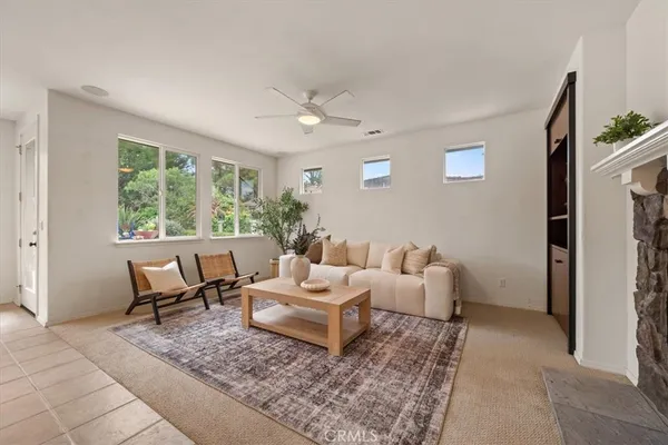 a living room with furniture and a large window