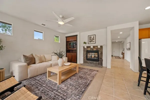 a living room with furniture and a rug