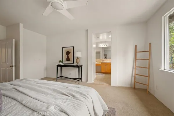 a bedroom with a bed and dresser