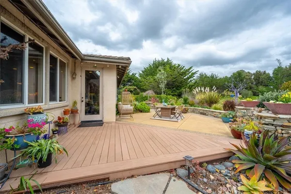 a view of a backyard with sitting area