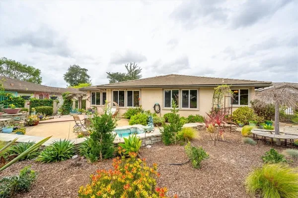 a view of house with garden