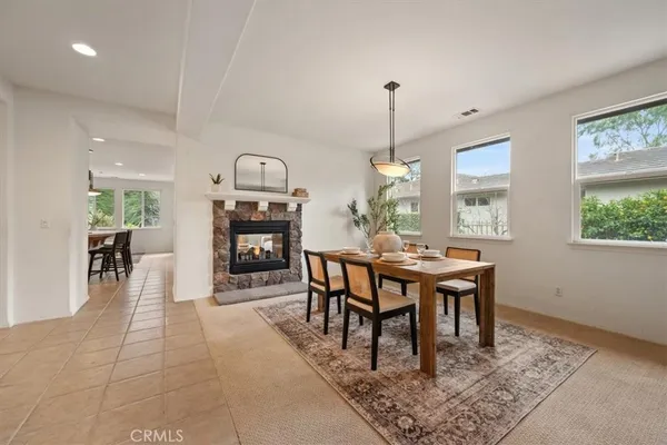 a dining room with a table and chairs