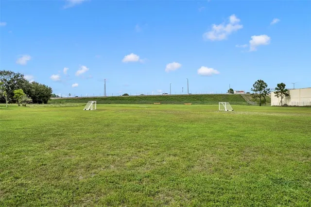 a view of a golf course with a lake