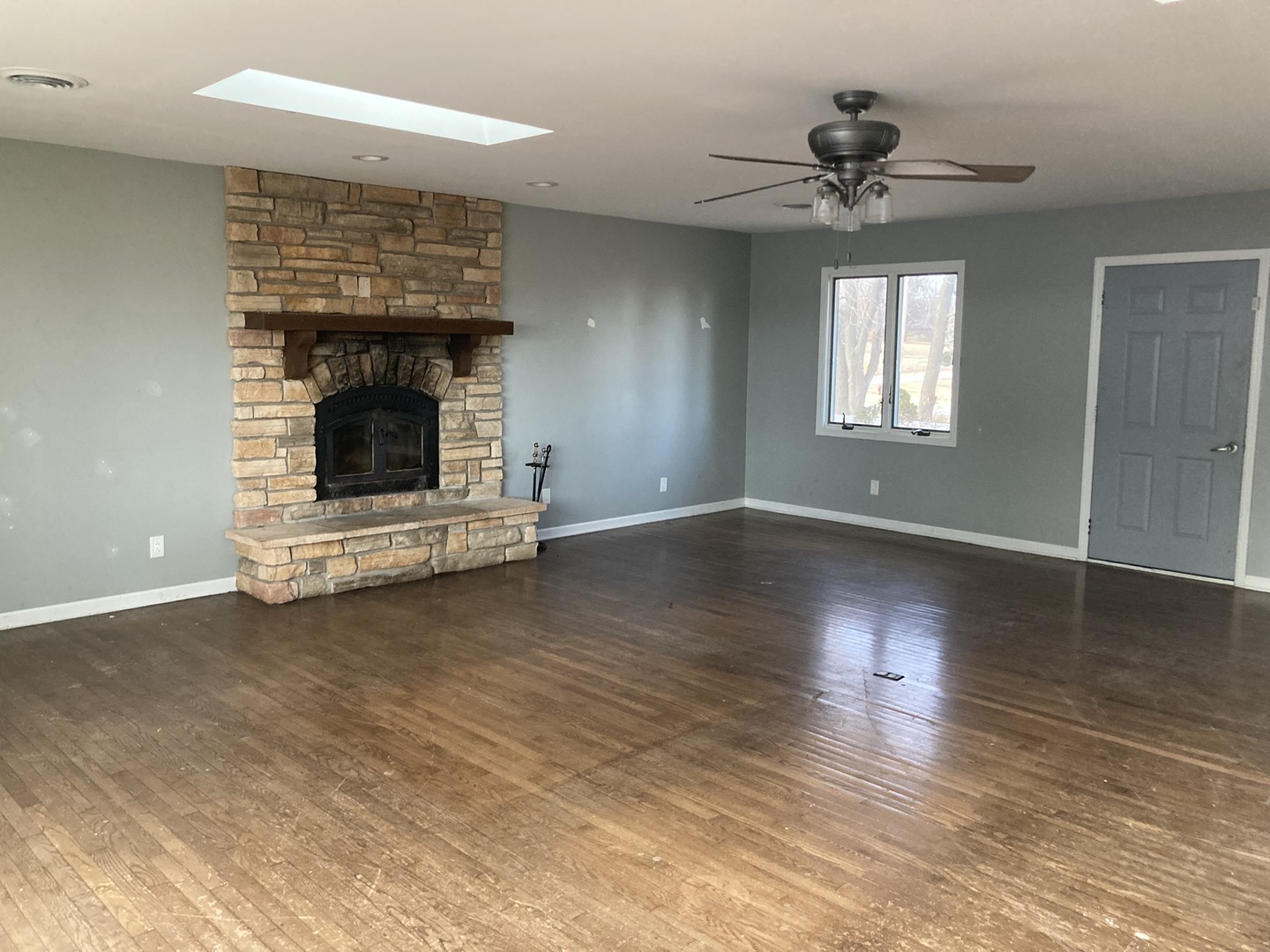 602 North 29th Road LaSalle, IL 61301 - Photo 15 of 28 a view of an empty room with wooden floor fireplace and a window