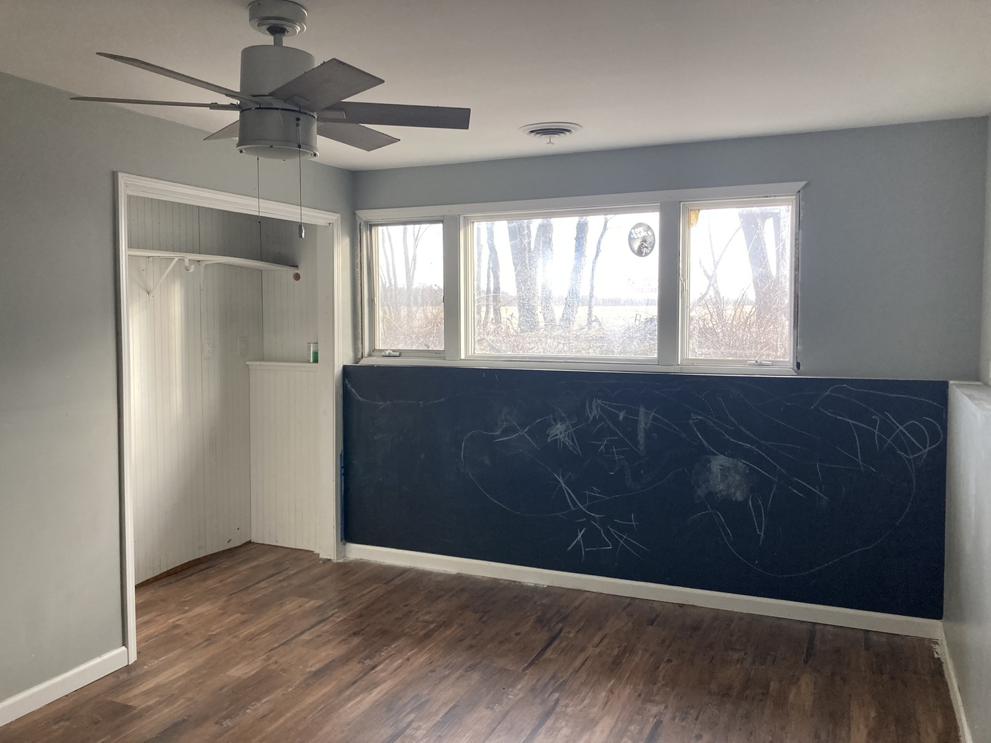 602 North 29th Road LaSalle, IL 61301 - Photo 17 of 28 a view of an empty room with a window and wooden floor