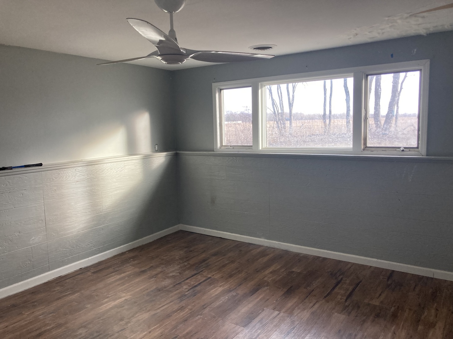 602 North 29th Road LaSalle, IL 61301 - Photo 18 of 28 a view of an empty room with wooden floor and a window