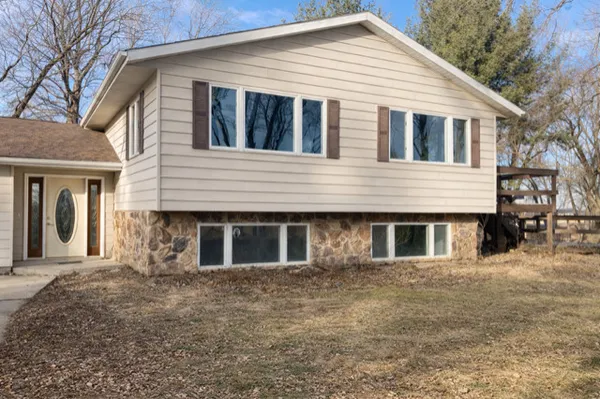 a front view of a house with large windows