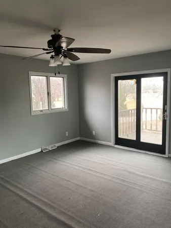 a view of an empty room with a window