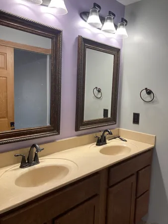 a bathroom with a sink and a mirror