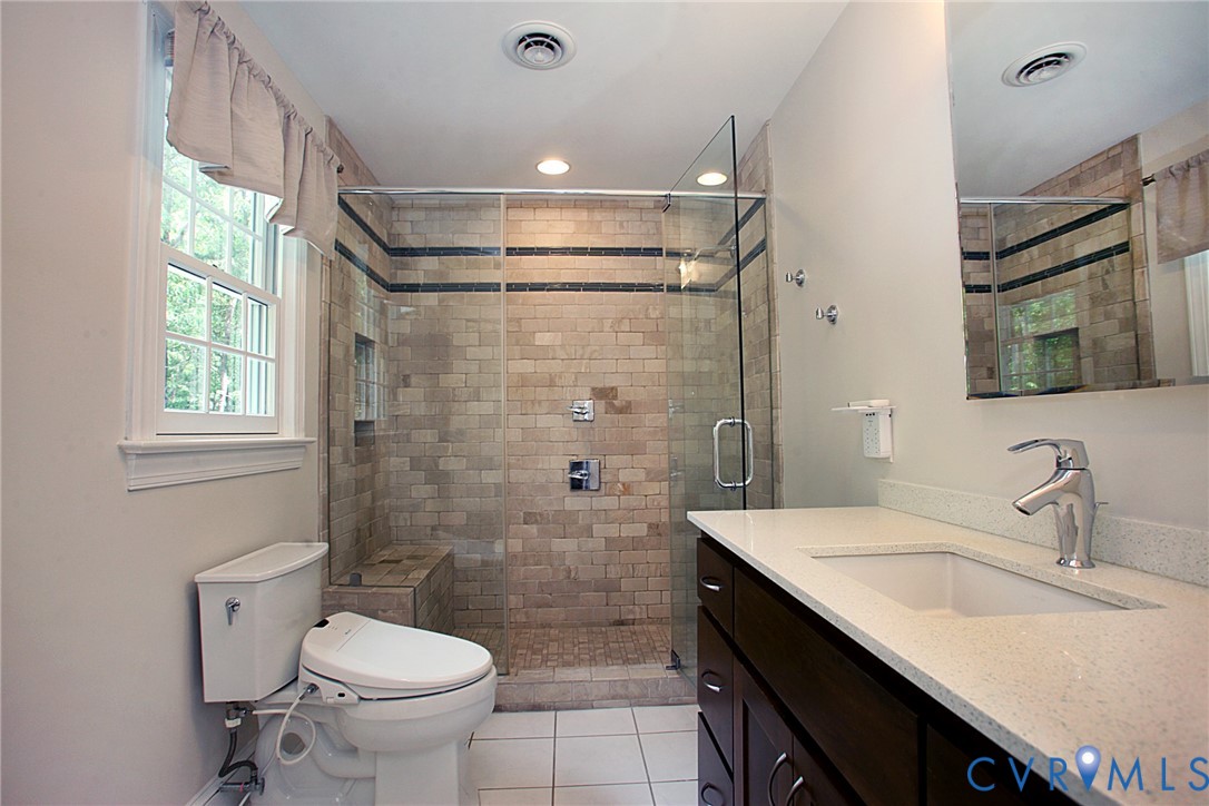 231 Hazelmere Drive Chesterfield, VA 23236 - Photo 19 of 33 a bathroom with a sink toilet double vanity and shower
