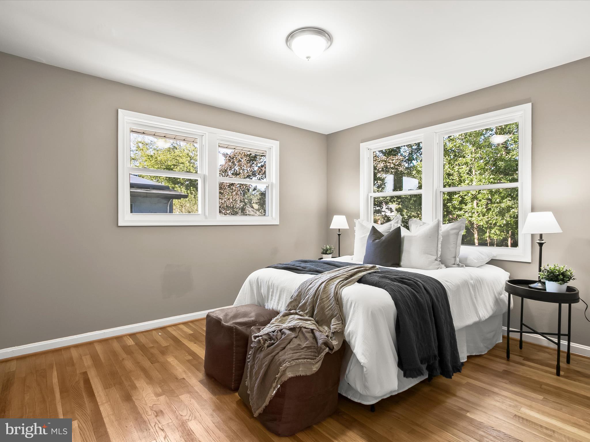 13211 Holdridge Road Silver Spring, MD 20906 - Photo 12 of 32 a bed room with a bed and a wooden floor