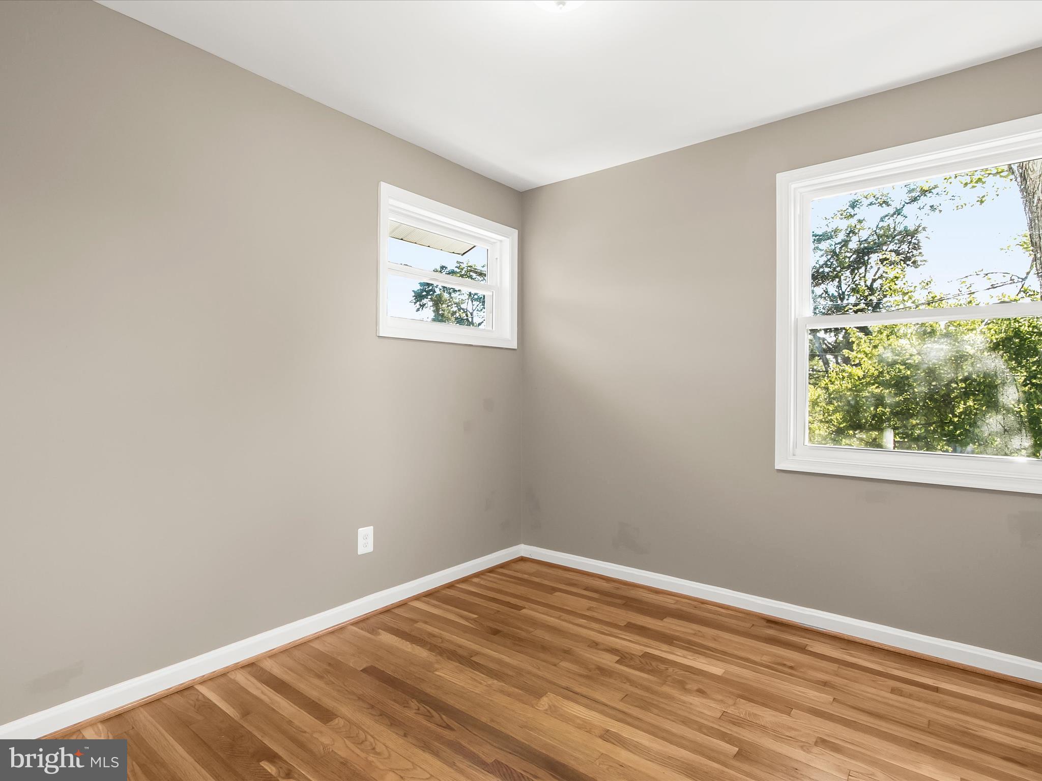 13211 Holdridge Road Silver Spring, MD 20906 - Photo 17 of 32 a view of a room with wooden floor and window