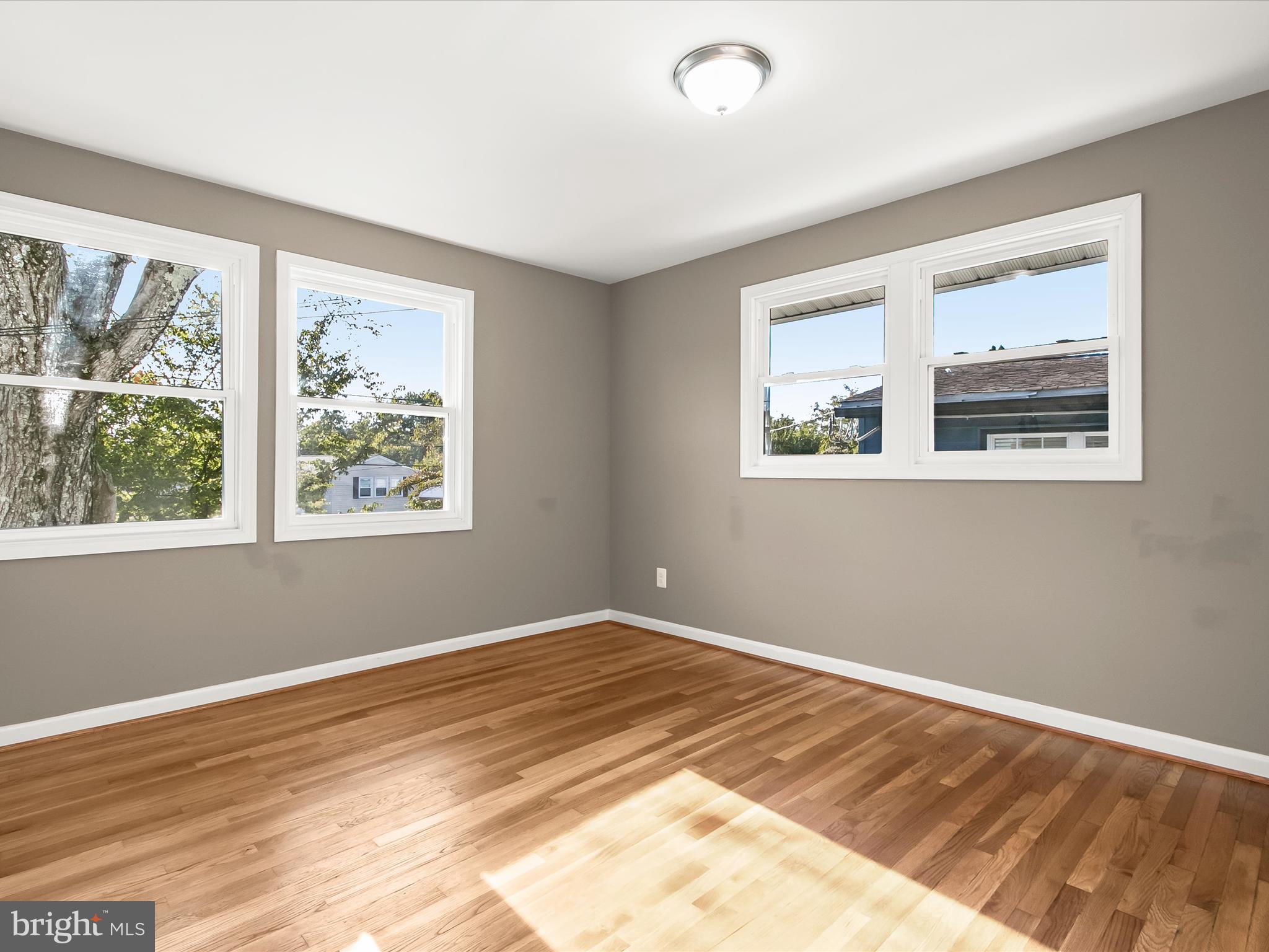 13211 Holdridge Road Silver Spring, MD 20906 - Photo 19 of 32 a view of a room with wooden floor and window