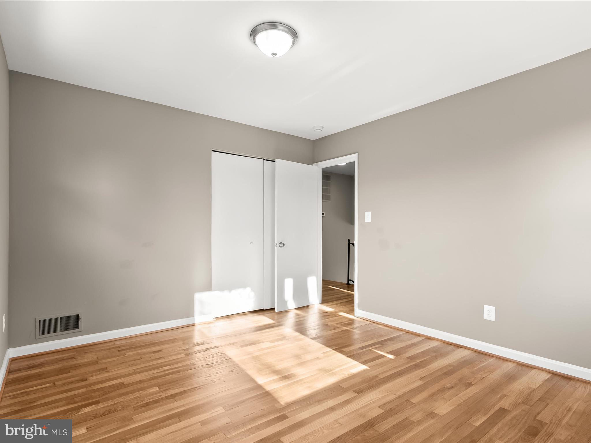 13211 Holdridge Road Silver Spring, MD 20906 - Photo 20 of 32 a view of an empty room and wooden floor