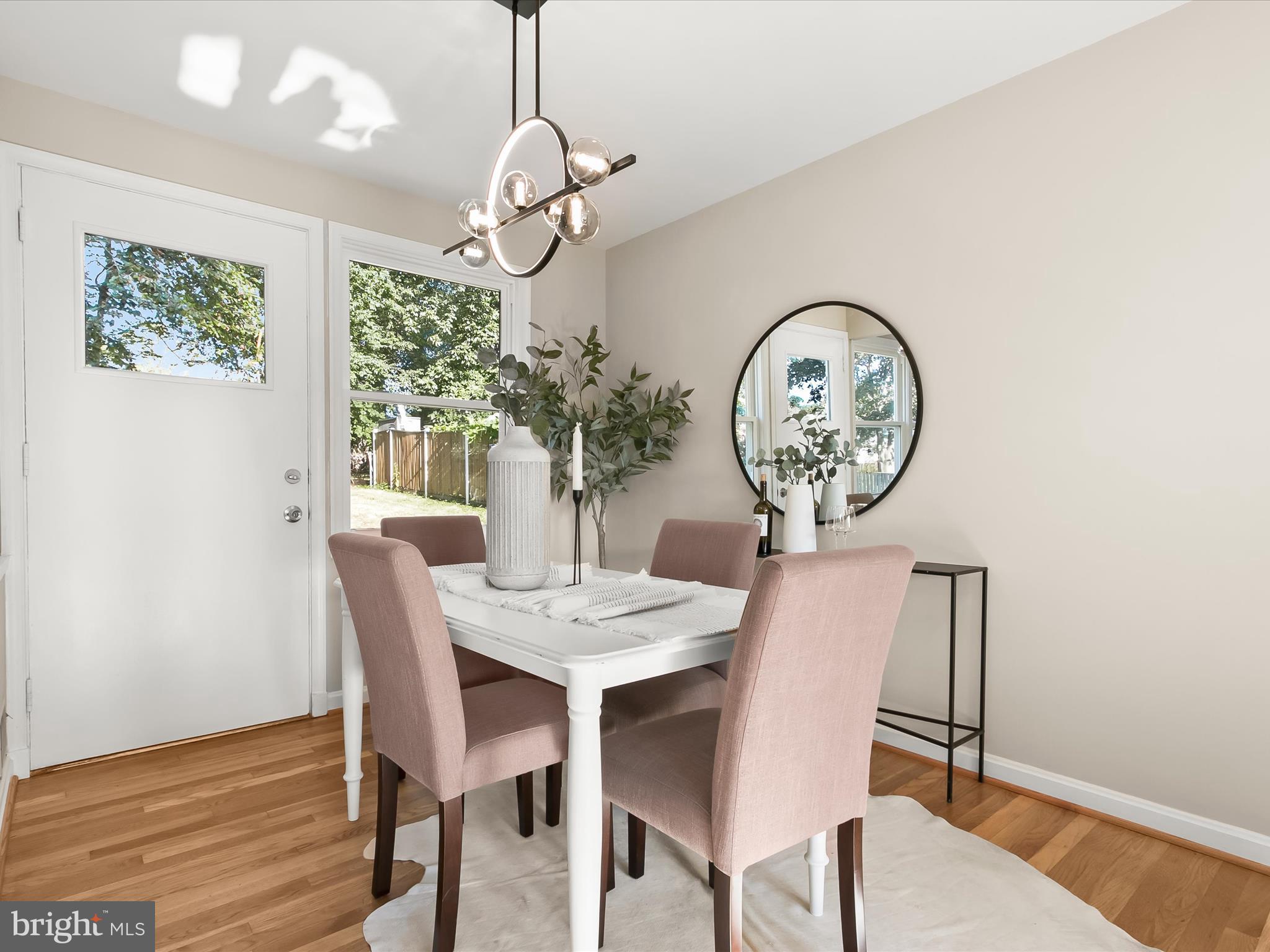 13211 Holdridge Road Silver Spring, MD 20906 - Photo 5 of 32 a view of a dining room with furniture a chandelier and wooden floor