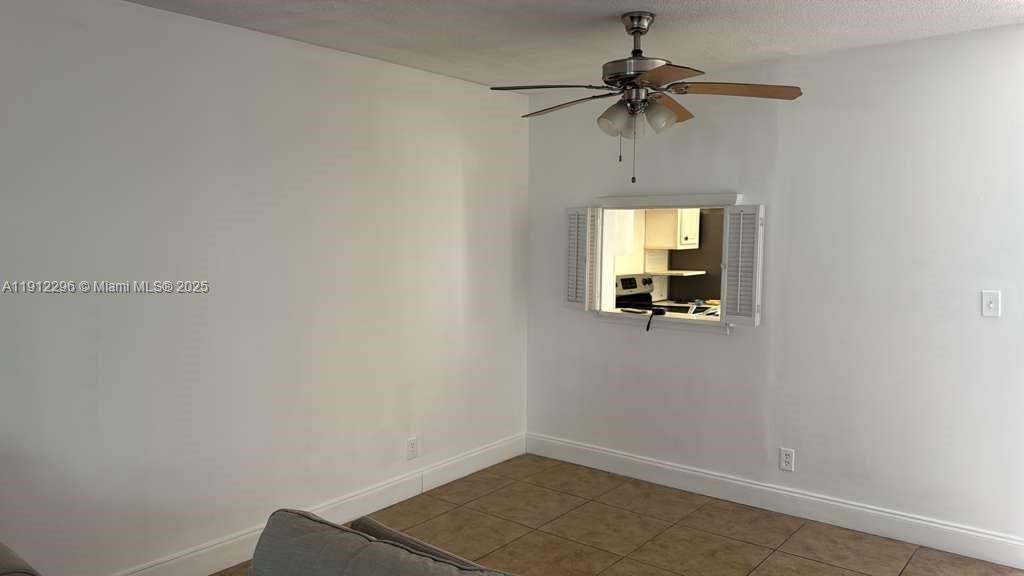 219 Northeast 14th Avenue, Unit 103 Hallandale Beach, FL 33009 - Photo 2 of 11 a view of a hallway with a window