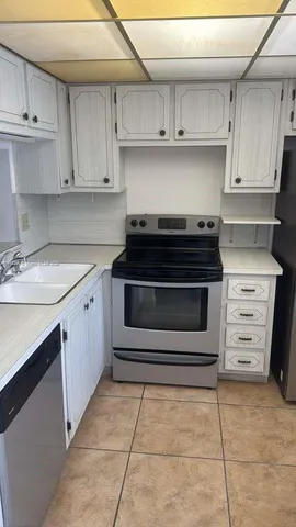 a kitchen with a stove and a sink
