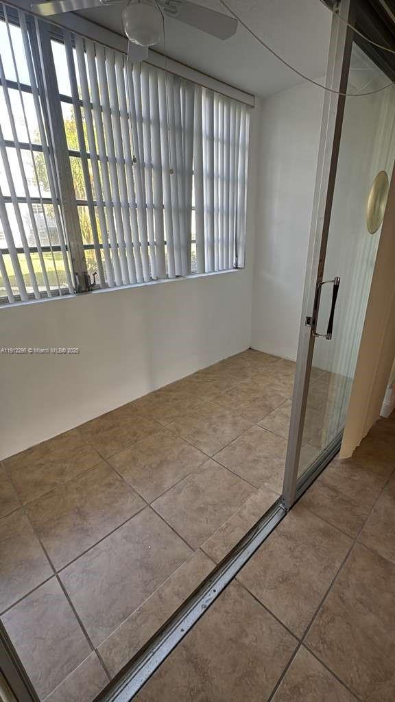 219 Northeast 14th Avenue, Unit 103 Hallandale Beach, FL 33009 - Photo 10 of 11 a view of an empty room and staircase