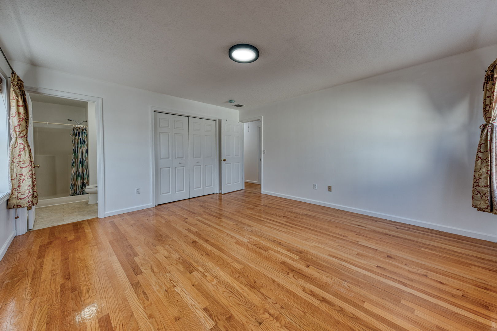 27 Aspen Place Windham, CT 06226 - Photo 19 of 39 a view of empty room with wooden floor