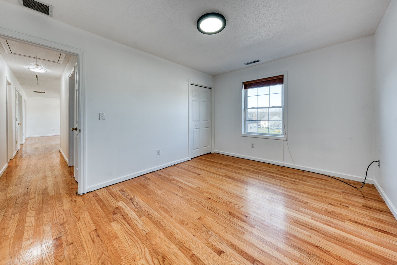 27 Aspen Place Windham, CT 06226 - Photo 26 of 39 a view of empty room with wooden floor