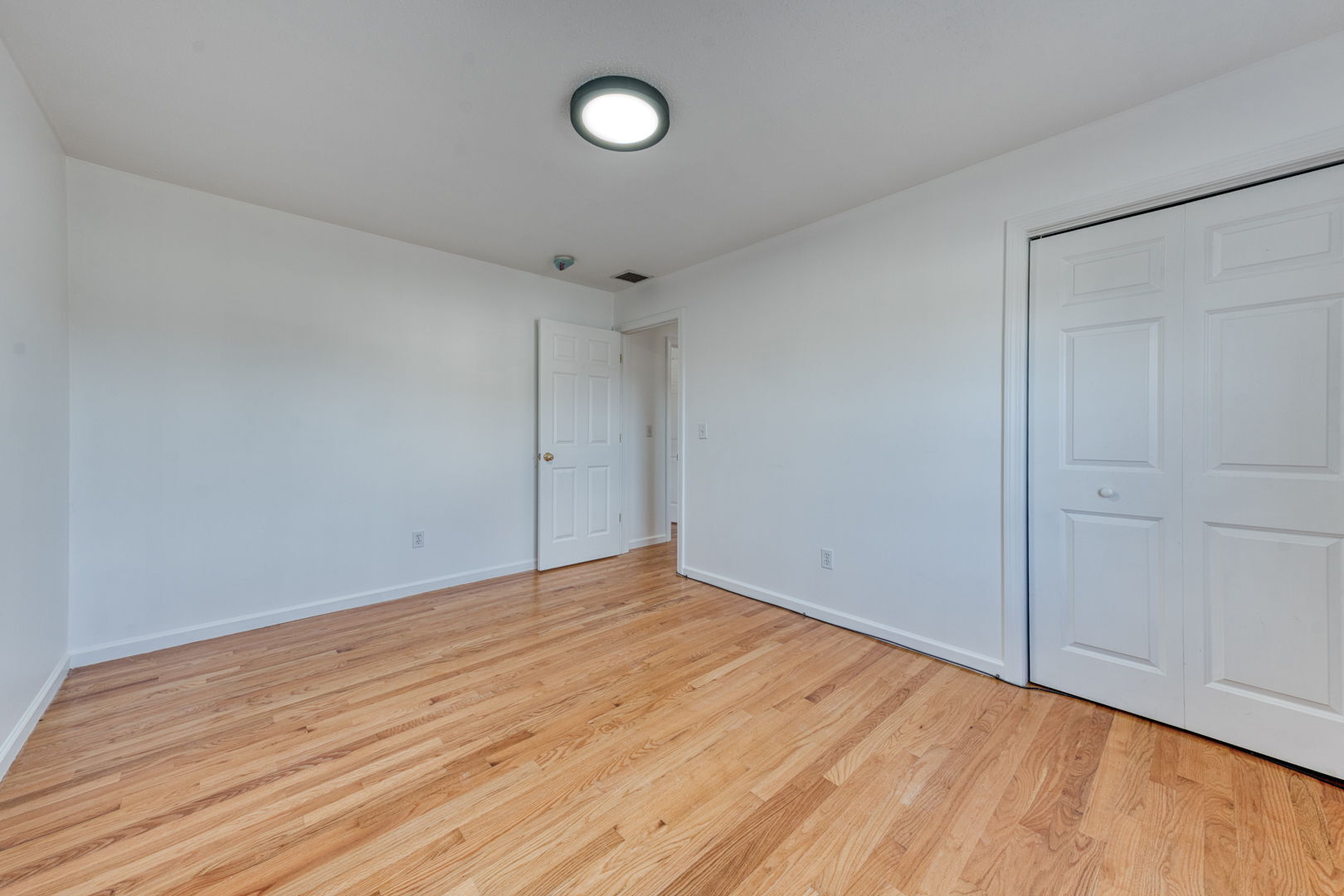 27 Aspen Place Windham, CT 06226 - Photo 27 of 39 a view of empty room with wooden floor