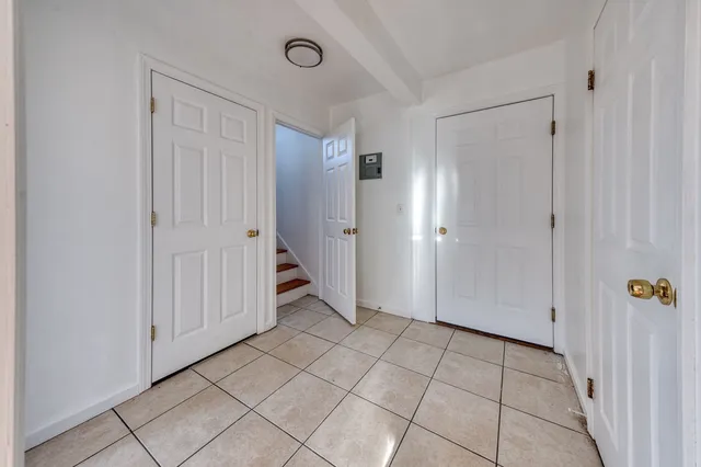 a view of a hallway and closet area
