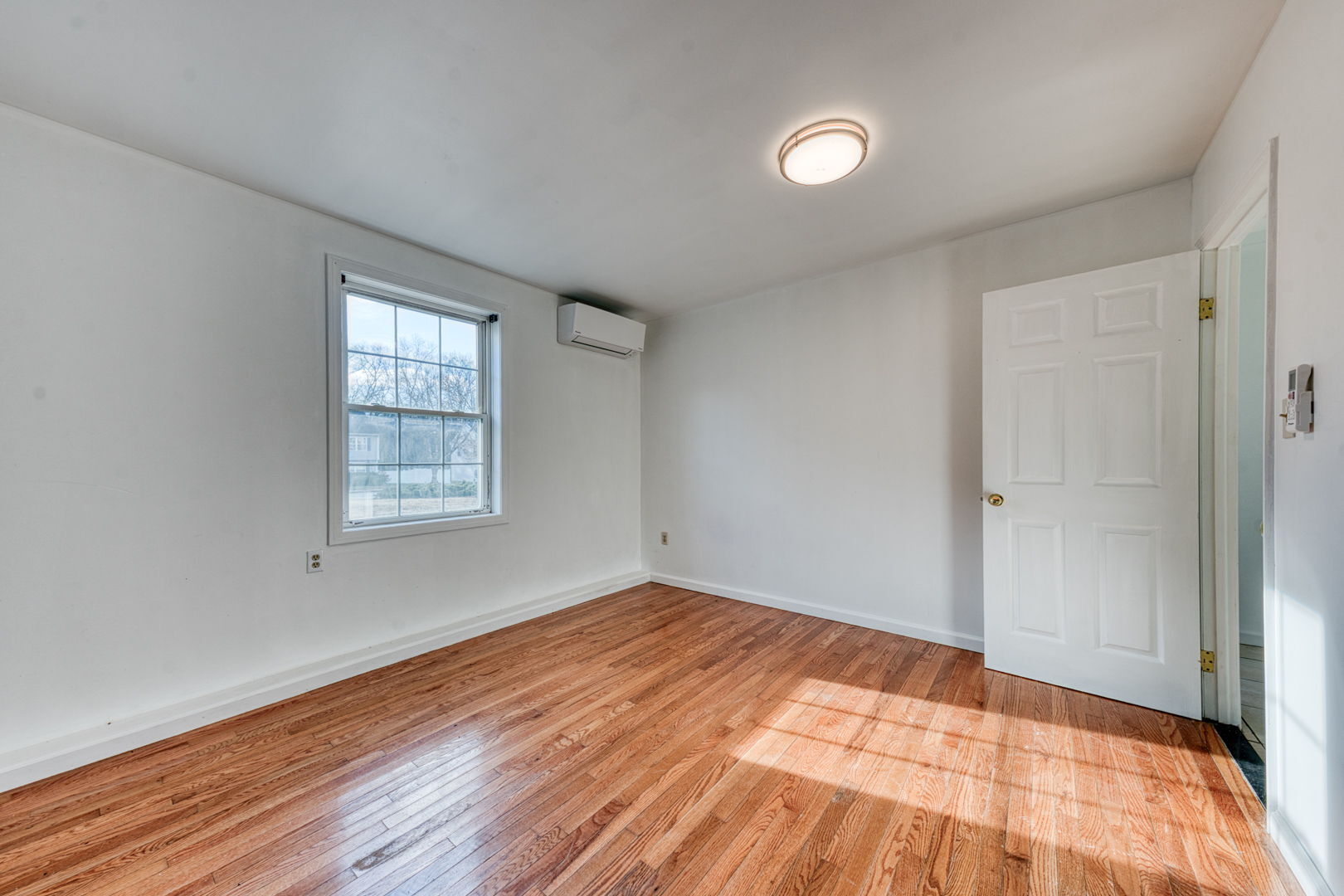 27 Aspen Place Windham, CT 06226 - Photo 32 of 39 wooden floor in an empty room with a window