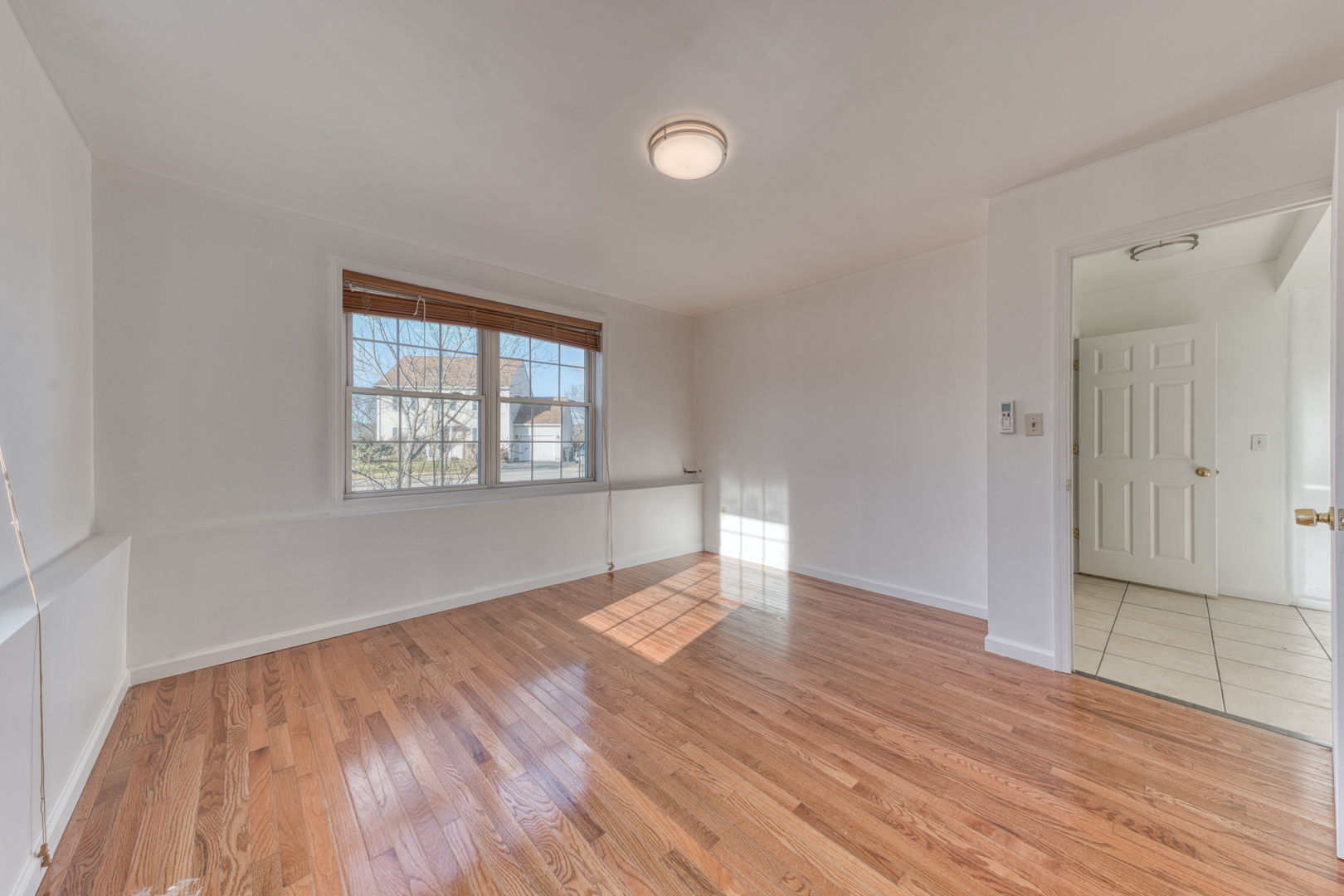 27 Aspen Place Windham, CT 06226 - Photo 34 of 39 wooden floor in an empty room with a window